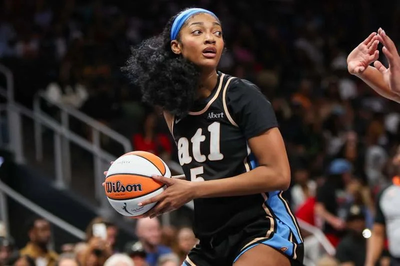 May 17, 2026; Atlanta, Georgia, USA; Atlanta Dream forward Angel Reese (5) handles the ball against the Las Vegas Aces in the fourth quarter at State Farm Arena. Mandatory Credit: Brett Davis-Imagn Images