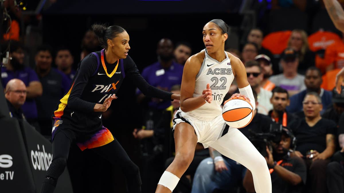 Las Vegas Aces center A'ja Wilson operates with the ball as Phoenix Mercury forward DeWanna Bonner defends during Game 3 of the WNBA Finals in Phoenix on Oct. 8, 2025.Mark J. Rebilas-Imagn Images