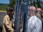 U.S. Rep. Marie Gluesenkamp Perez of Washington’s third congressional district speaks with family members of victims following a press conference at the Nippon Dynawave Packaging Co., on May 27, 2026. 