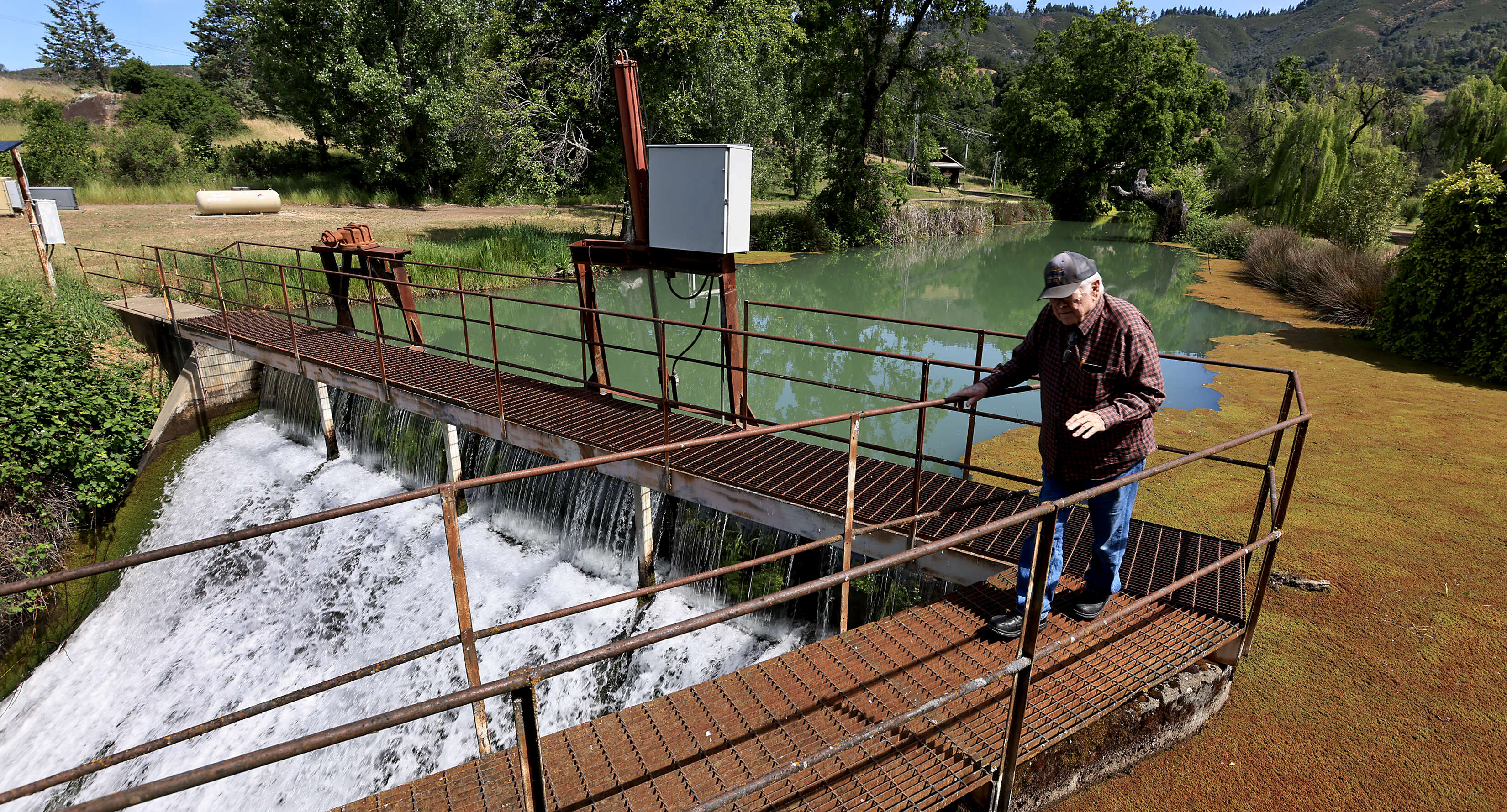 Guinness McFadden checks on the flow of diverted Eel River...
