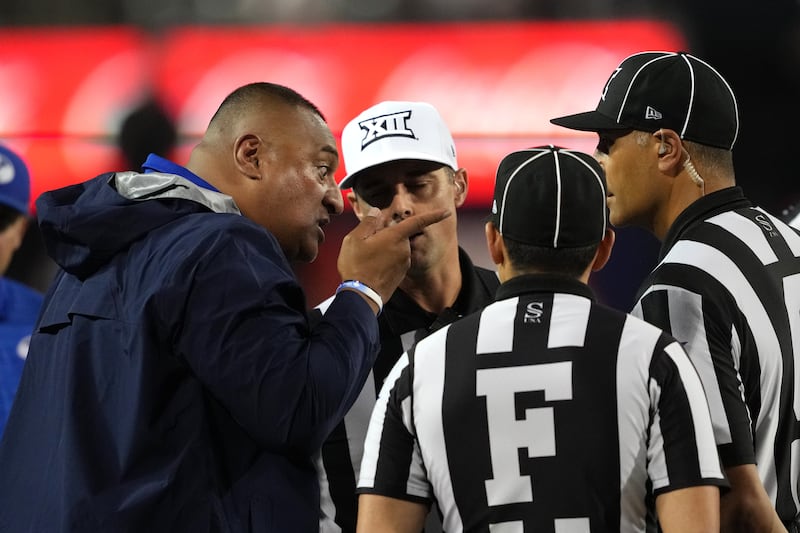 BYU head coach Kalani Sitake talks with the officials during game against Arizona, Saturday, Oct. 11, 2025, in Tucson, Ariz.