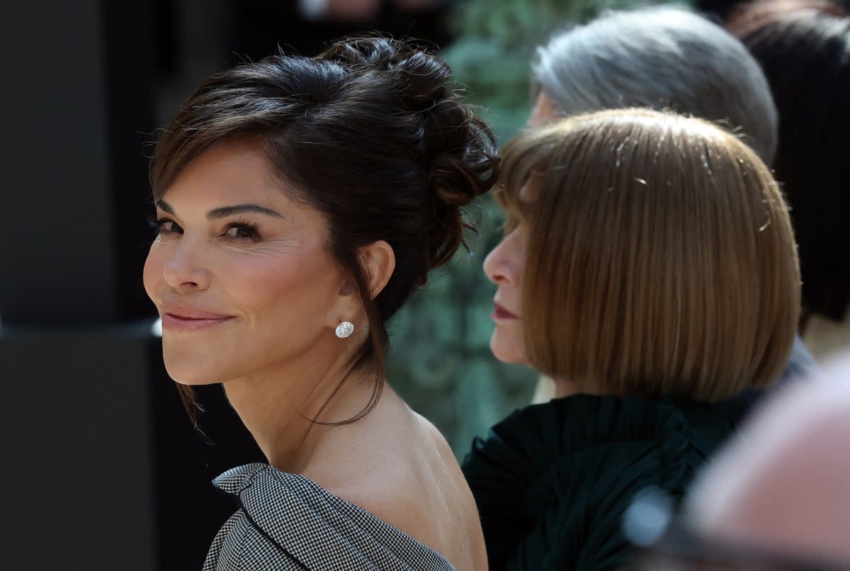 Mrs Bezos appeared in the front row at a Monday press conference next to Vogue executive Anna Wintour (AFP/Getty)