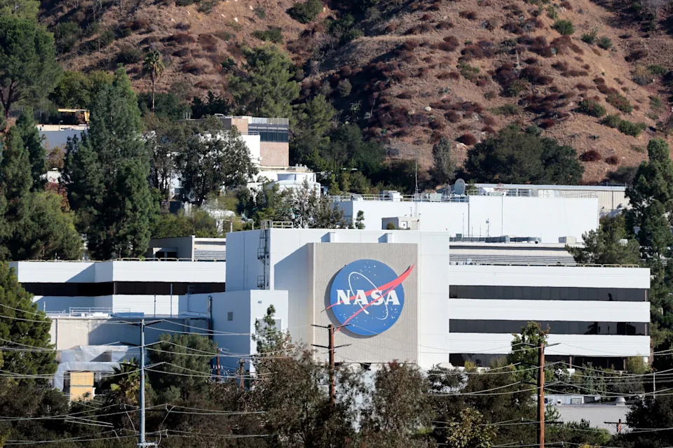 Mario Tama/Getty Images - PHOTO: The NASA logo is displayed at NASA's Jet Propulsion Laboratory on October 15, 2025 in La Canada Flintridge, California.