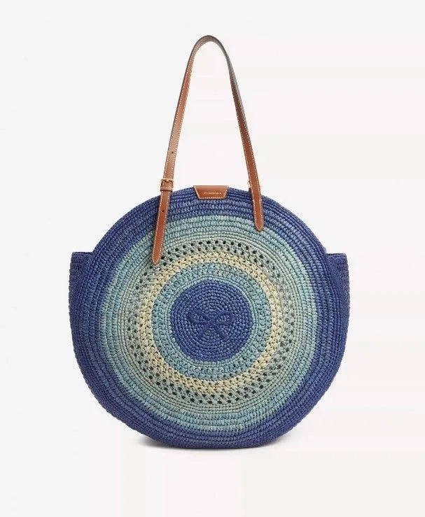 Harriet carried this bag by Anya Hindmarch, known as the 'Raffia Round Bow Tote' in 'Monday Blue'