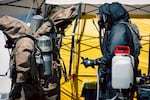 Soldiers and airmen from the Washington National Guard's 10th Homeland Response Force offer support to first responders following an implosion of a chemical tank at Nippon Dynawave pulp and paper mill on Thursday, May 28, 2026, in Longview, Wash.