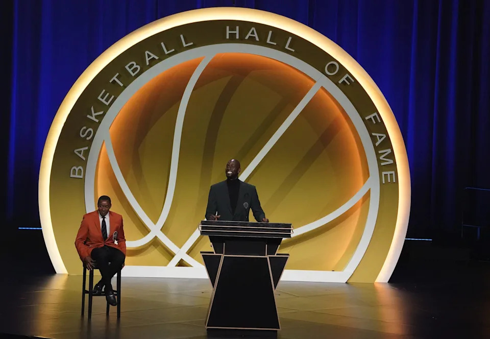 May 15, 2021; Uncasville, Connecticut, USA; Class of 2020 inductee Kevin Garnett with Isiah Thomas (left), speaks during the Naismith Memorial Basketball Hall of Fame Enshrinement ceremony at Mohegan Sun Arena. Mandatory Credit: David Butler II-USA TODAY Sports