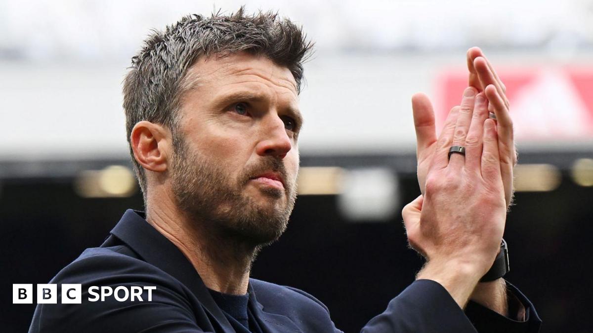 Manchester United caretaker head coach Michael Carrick applauds supporters after victory over Liverpool