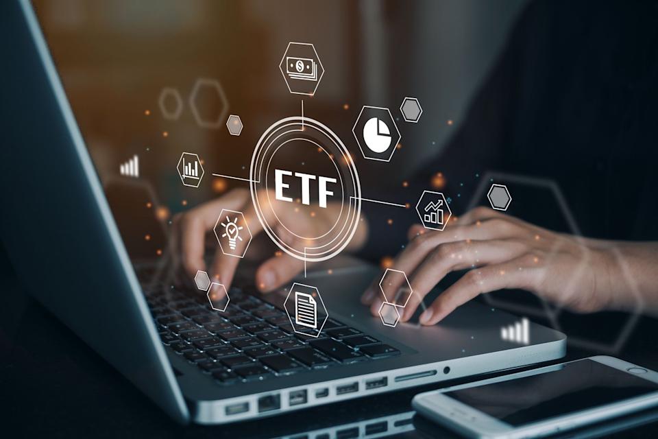 An investor buying an ETF from their laptop.
