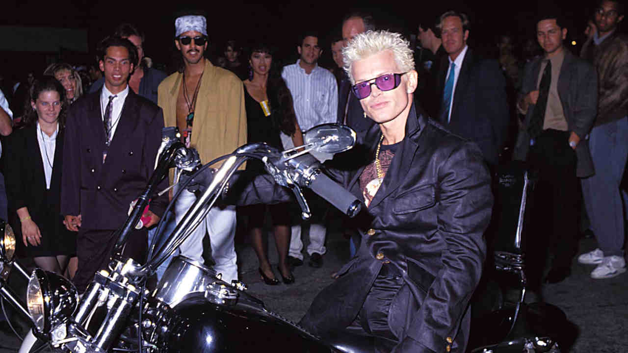 Billy Idol arriving at the 1991 MTV Awards on a motorbike