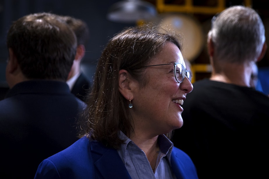 caption: Congresswoman Suzan DelBene talks with guests ahead of a primary election night party for Bob Ferguson, the Democrat gubernatorial candidate for Washington state, on Tuesday, August 6, 2024, at Reuben’s Barrel House event space in Seattle. 