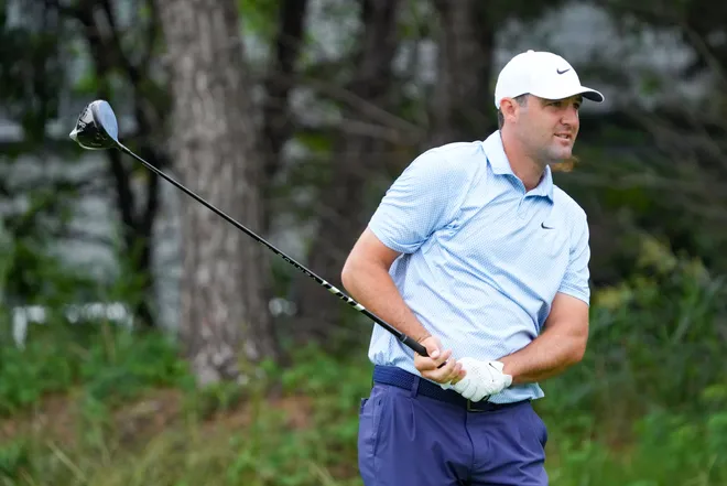 May 21, 2026; McKinney, Texas, USA; Scottie Scheffler plays his shot from the 14th tee during the first round of THE CJ CUP Byron Nelson golf tournament. Mandatory Credit: Raymond Carlin III-Imagn Images