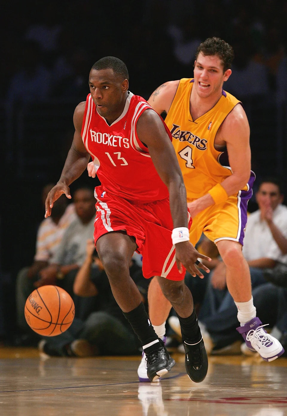 LOS ANGELES, CA - MARCH 30: Kirk Snyder #13 of the Houston Rockets drives upcourt against Luke Walton #4 of the Los Angeles Lakers at Staples Center on March 30, 2007 in Los Angeles, California. NOTE TO USER: User expressly acknowledges and agrees that, by downloading and or using this Photograph, user is consenting to the terms and conditions of the Getty Images License Agreement. (Photo by Lisa Blumenfeld/Getty Images)