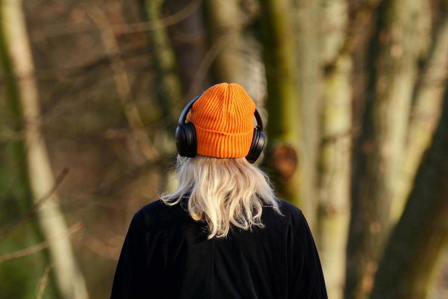 A woman listening to headphones