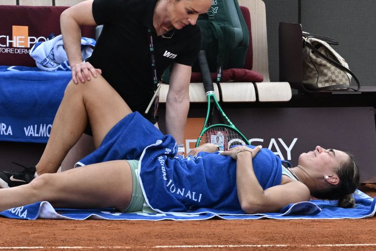 Belarus' Aryna Sabalenka receives medical support during her match against Romania's Sorana Cirstea during the WTA Rome Open tennis tournament at Foro Italico in Rome on May 9, 2026. (Photo by Tiziana FABI / AFP)