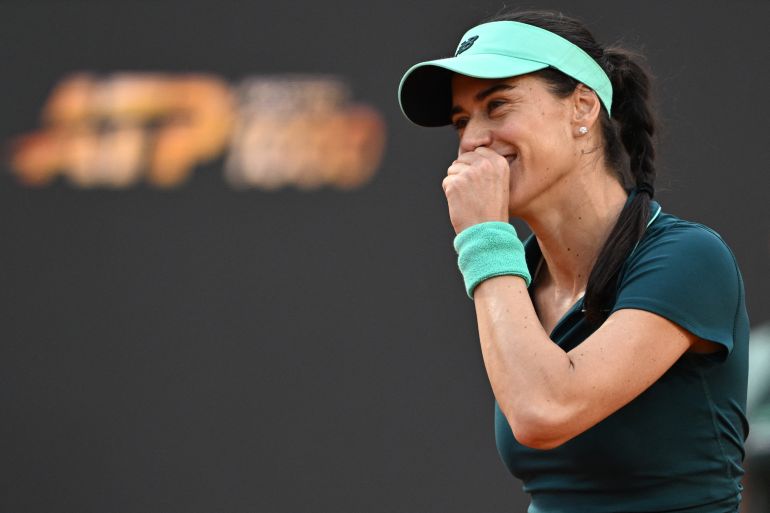 Romania's Sorana Cirstea celebrates after winning against Belarus' Aryna Sabalenka during the WTA Rome Open tennis tournament at Foro Italico in Rome on May 9, 2026. (Photo by Tiziana FABI / AFP)