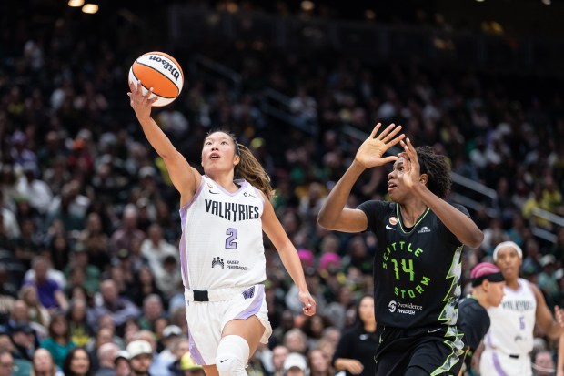 Golden State Valkyries guard Kaitlyn Chen, left, goes up for a host against Seattle Storm center Dominique Malonga during a WNBA basketball game in Seattle, Friday, May 8, 2026. (AP Photo/Stephen Brashear)