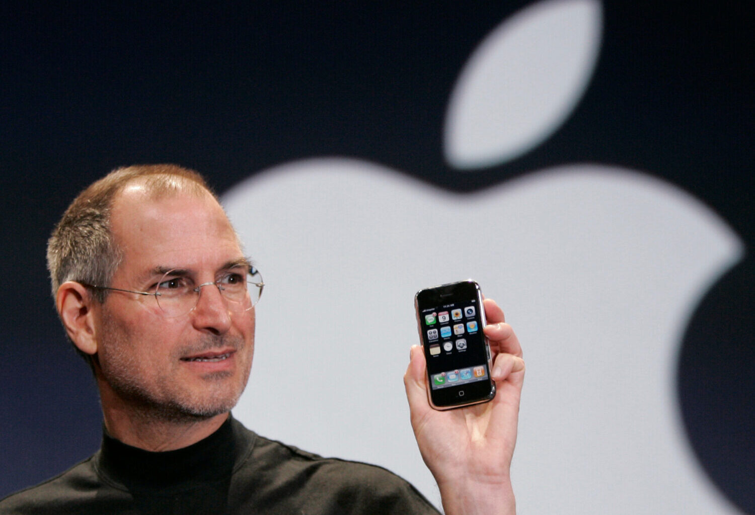 FILE - Apple CEO Steve Jobs holds up an Apple iPhone at the MacWorld Conference in San Francisco on...