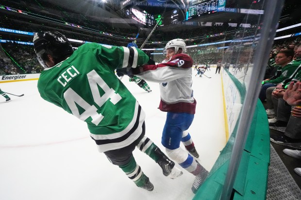 Dallas Stars' Cody Ceci (44) and Colorado Avalanche's Nathan MacKinnon (29) work against each other in the second period in Game 7 of a first-round NHL hockey playoff series Saturday, May 3, 2025, in Dallas. (AP Photo/Julio Cortez)