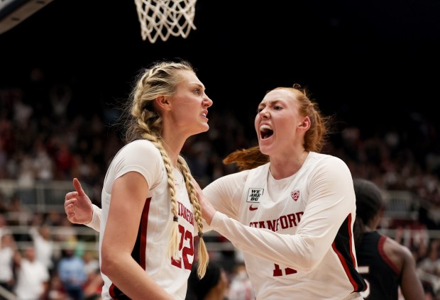 Stanford Cardinal's Ashten Prechtel (11) celebrates with Stanford Cardinal's Cameron Brink (22) after a play against South Carolina Gamecocks in the second half at Stanford Maples Pavilion in Stanford, Calif., on Sunday, Nov. 20, 2022. (Shae Hammond/Bay Area News Group)