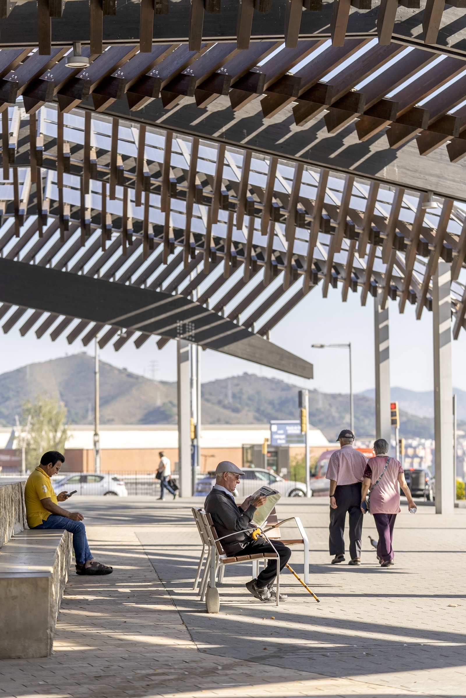 A shade structure shields people from the sun in Barcelona