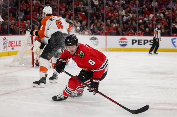 Blackhawks center Ryan Donato chases after the puck during the first period against the Flyers on Dec. 23, 2025, at the United Center. (Armando L. Sanchez/Chicago Tribune)