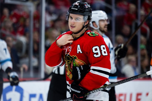 Blackhawks center Connor Bedard adjusts his necklace in the third period against the Mammoth on March, 9, 2026, at the United Center. (Josh Boland/Chicago Tribune)