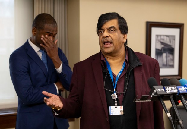 Resilience Healthcare CEO Dr. Manoj Prasad speaks alongside state Rep. La Shawn Ford about the sudden closing and financial situation of the West Suburban Medical Center in Oak Park, April 1, 2026. (Brian Cassella/Chicago Tribune)