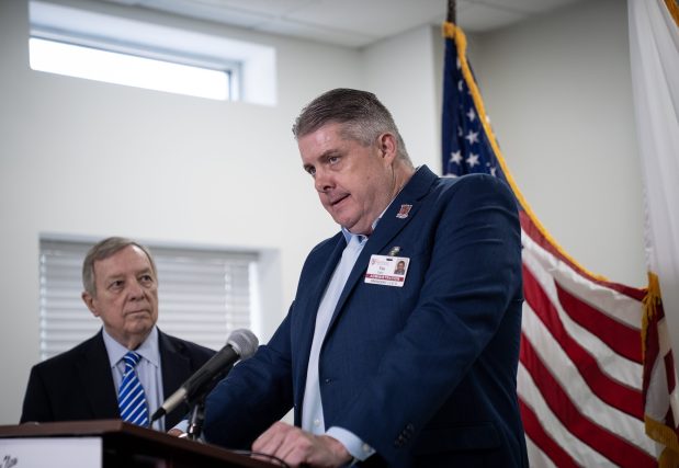 Roseland Community Hospital CEO Tim Egan speaks to the media as U.S. Sen. Dick Durbin, left, visits the Far South Side hospital to highlight the threats to safety net hospitals in Illinois from Medicaid cuts on July 11, 2025. (E. Jason Wambsgans/Chicago Tribune)