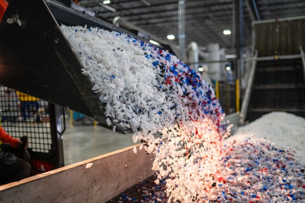 Plastic is loaded onto a conveyer belt at ExxonMobil's chemical recycling plant on Oct. 11, 2023, in Baytown, Texas. ExxonMobil's facility is one of only 11 US chemical recycling plants constructed, according to an October report by Beyond Plastics, which said the small number is indicative of a process that is "energy-intensive, expensive, and infeasible." Even if all 11 were operating at full capacity, the report said, they would handle less than 1.3 percent of US plastic waste generated per year. (Sergio Flores/Getty-AFP)