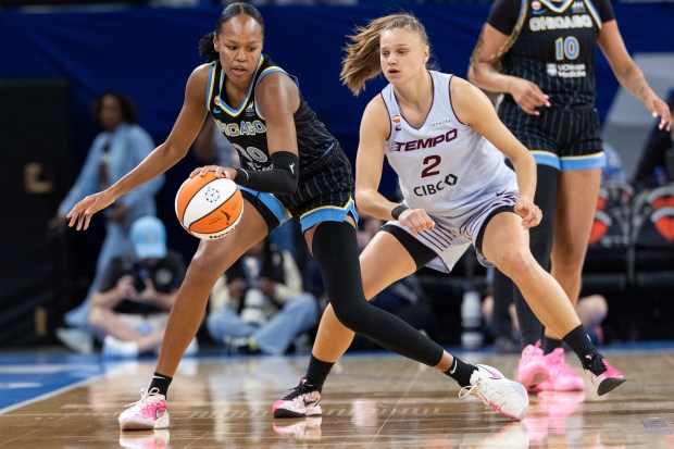 Sky forward-center Azurá Stevens works against Toronto Tempo forward Laura Juskaite during the first quarter on May 27, 2026, at Wintrust Arena. (Josh Boland/Chicago Tribune)