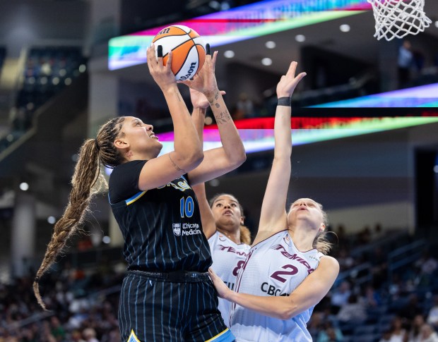 Sky center Kamilla Cardoso goes for a layup over Toronto Tempo forwards Nyara Sabally and Laura Juskaite (2) in the third quarter Wednesday, May 27, 2026, at Wintrust Arena. (Josh Boland/Chicago Tribune)