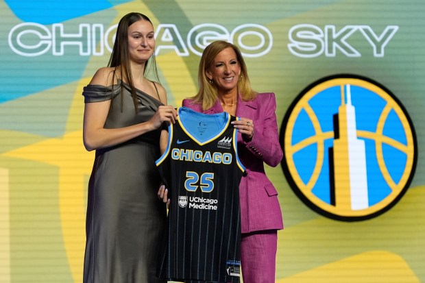 Ajsa Sivka, left, poses for a photo with WNBA Commissioner Cathy Engelbert after being selected 10th by the Sky during the first round of the WNBA draft April 14, 2025, in New York. (AP Photo/Pamela Smith)