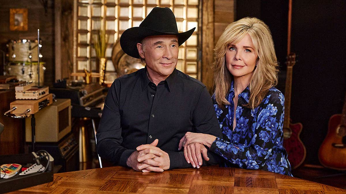 Lisa Hartman Black holding onto Clint Black's arm in a scene from Lifetime's "When I Said I Do."