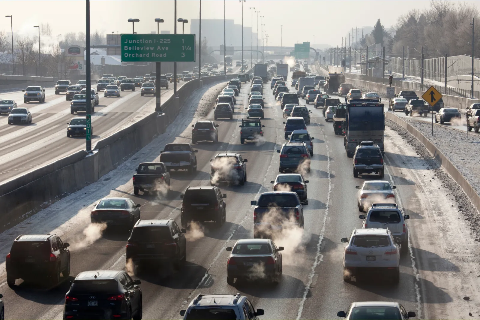 File photo: Multiple lanes of traffic crawl slowly on southbound Interstate-25 in Denver, Colorado, as exhaust fumes rise into the air on December 6, 2013.