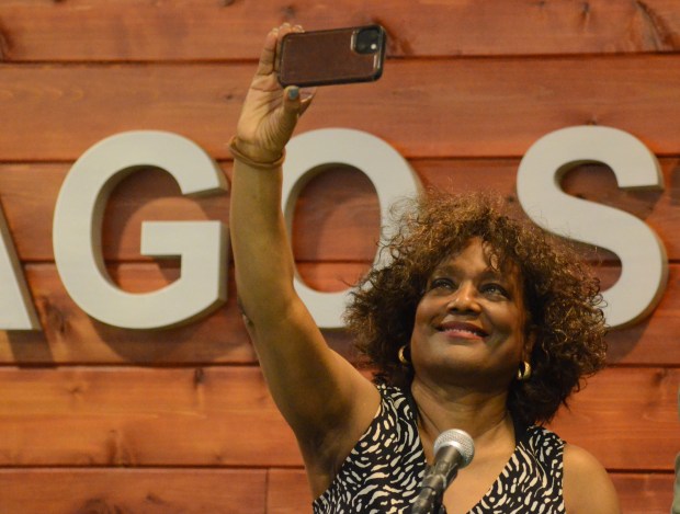 Park Forest native Marla Dillard takes a photo of the audience Saturday at the screening of the "Revisiting Utopia" documentary at Chicago State University. May 16, 2026. (Jeff Vorva/for the Daily Southtown)