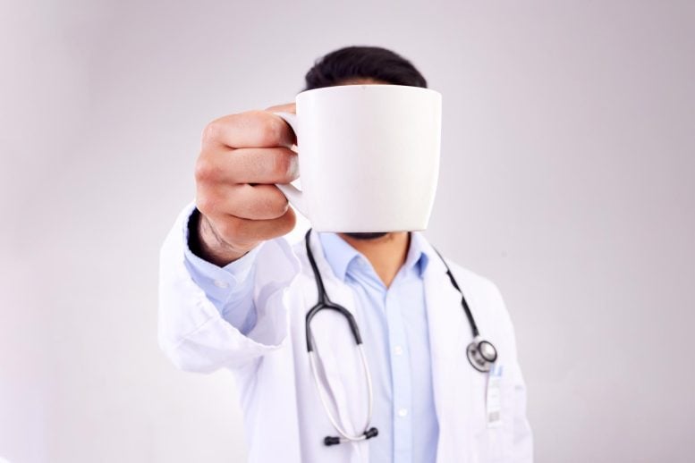 Doctor Holding Coffee Mug High