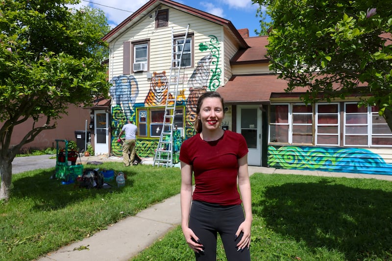 Landlord Christina Dischiave commissioned artist David Smart to paint zoo animals on the exterior of her rental property at 521 S. Wilbur Ave. in Syracuse.