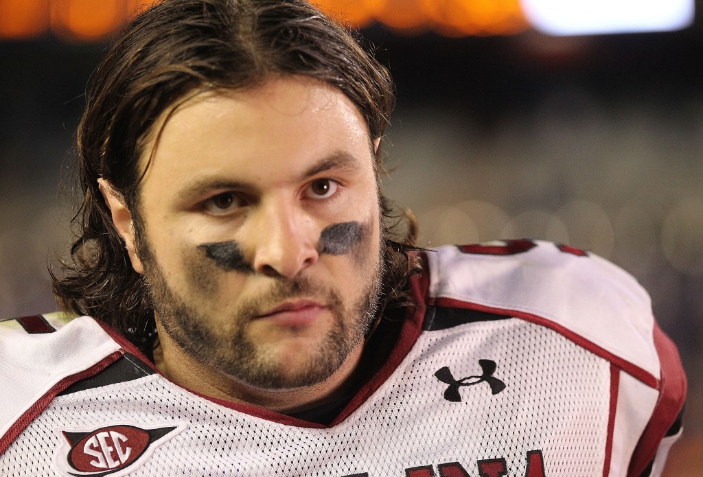 Stephen Garcia #5 of the South Carolina Gamecocks answers questions after winning a game against the Florida Gators at Ben Hill Griffin Stadium on November 13, 2010