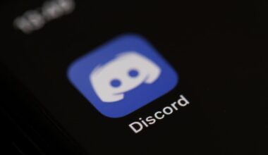 The logo of the social network application Discord on the screen of a phone.