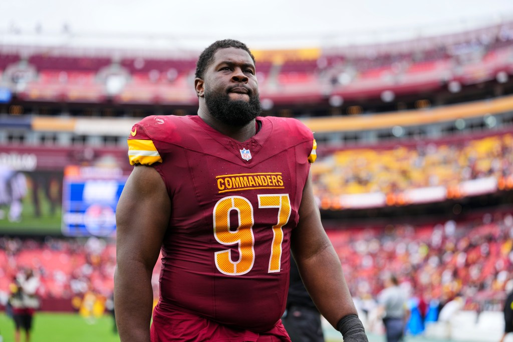 Eddie Goldman #97 of the Washington Commanders walks off of the field after an NFL football game against the Las Vegas Raiders at Northwest Stadium on September 21, 2025 in Landover, Maryland. 