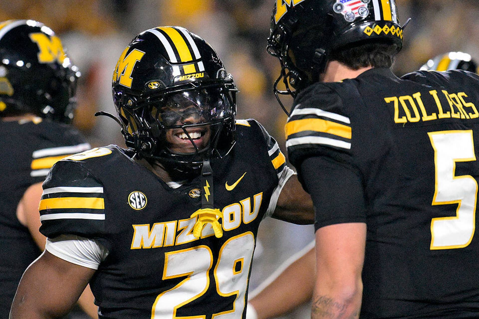 Missouri's Ahmad Hardy is congratulated by Matt Zollers after scoring a touchdown.