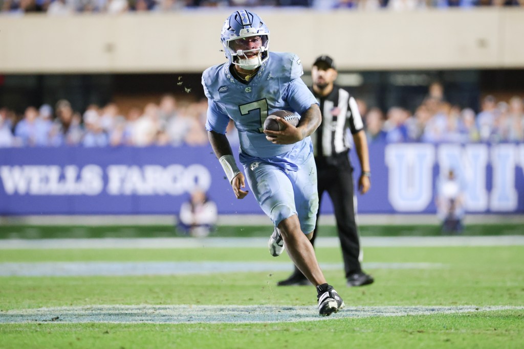Gio Lopez #7 of the North Carolina Tar Heels runs the ball during the game between the Duke Blue Devils and the North Carolina Tar Heels on November 22, 2025 at Kenan Memorial Stadium in Chapel Hill, NC. 