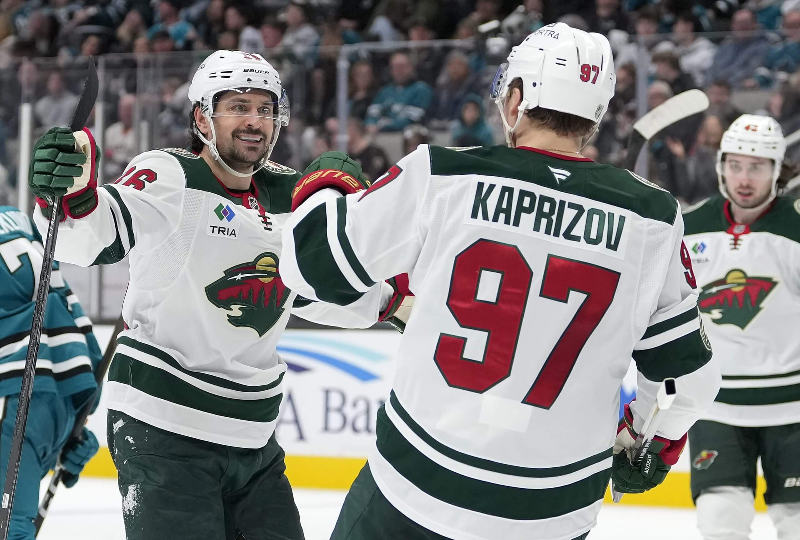 Mats Zuccarello and Kirill Kaprizov celebrate after a Wild goal.