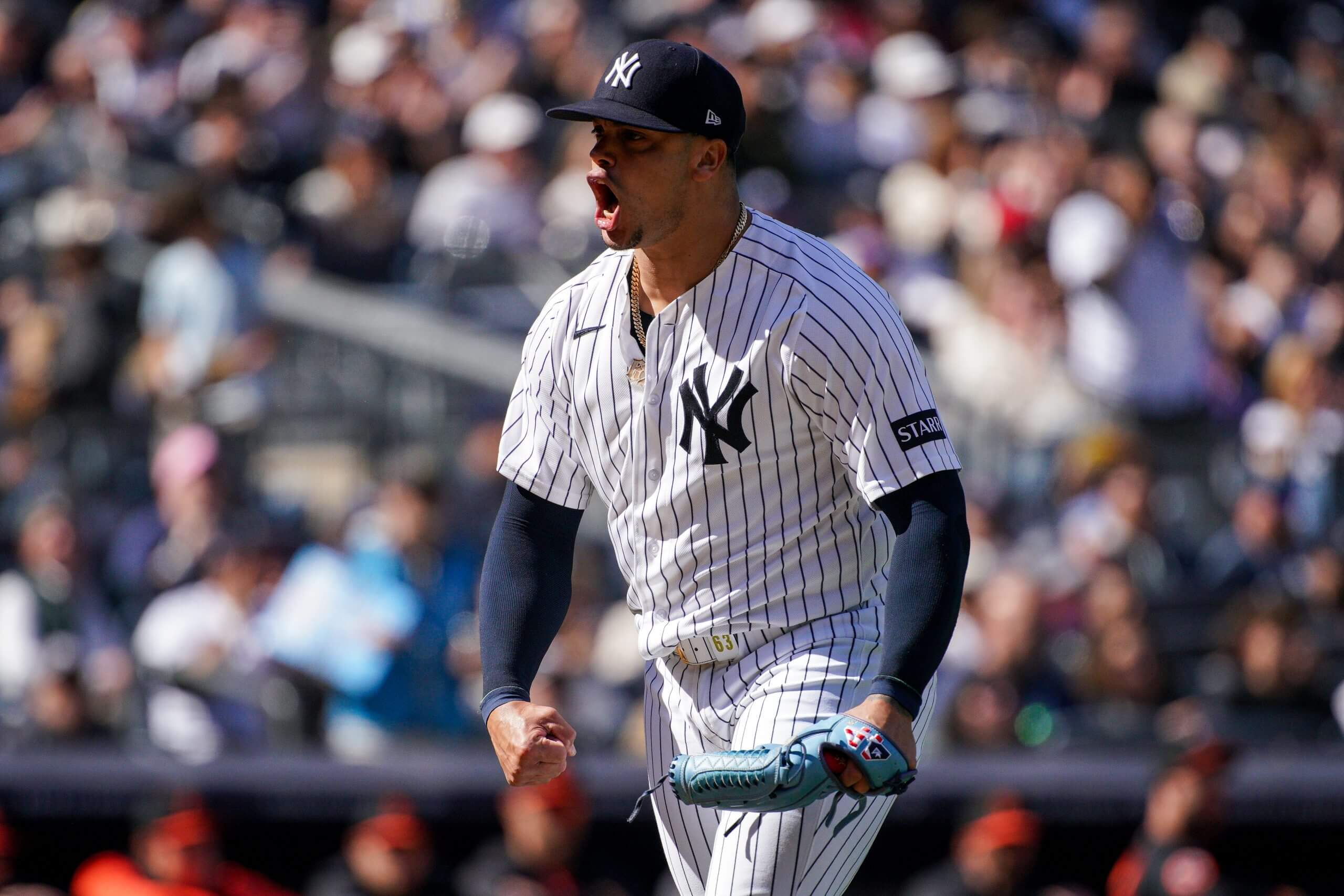 The Yankees' Fernando Cruz flexes after inducing a double play against the Orioles.