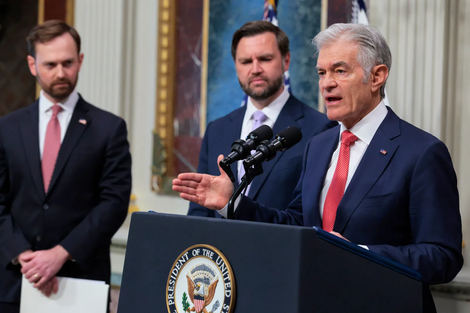 Administrator for the Centers for Medicare & Medicaid Services Dr. Mehmet Oz (R) speaks alongside Chairman of the Federal Trade Commission (FTC) Andrew Ferguson (L) and U.S. Vice President JD Vance (C) during a press conference on the Trump administration's anti-fraud initiatives at the Eisenhower Executive Office Building on May 13, 2026, in Washington, D.C.