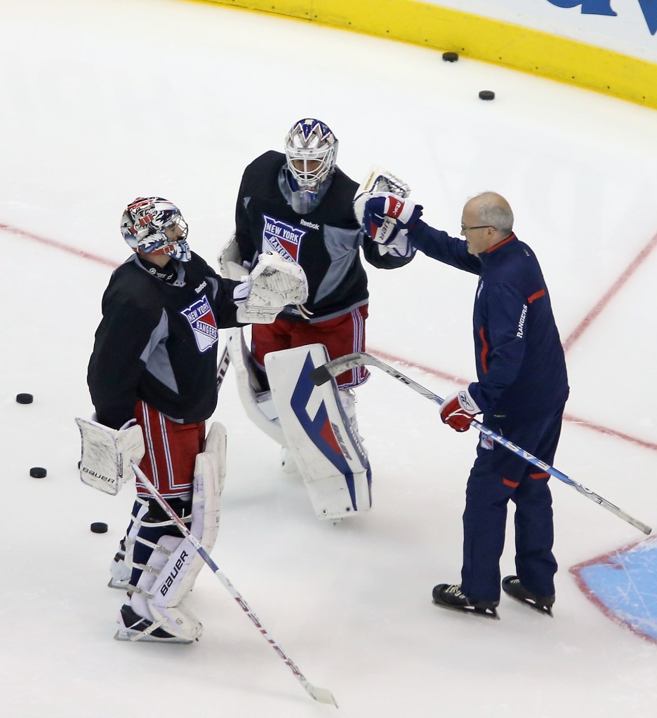 David Leneveu #29, Henrik Lundqvist #30 and goaltending coach Benoit Allaire of the New York Rangers take part in a practice session on an off day during the 2014 NHL Stanley Cup playoffs at Staples Center on June 6, 2014 in Los Angeles, California.