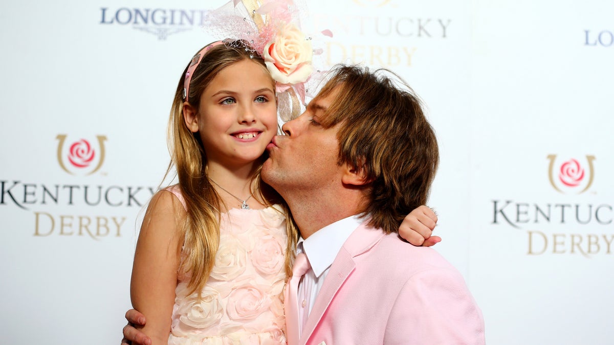 Larry Birkhead and Dannielynn Birkhead attending the Kentucky Derby at Churchill Downs