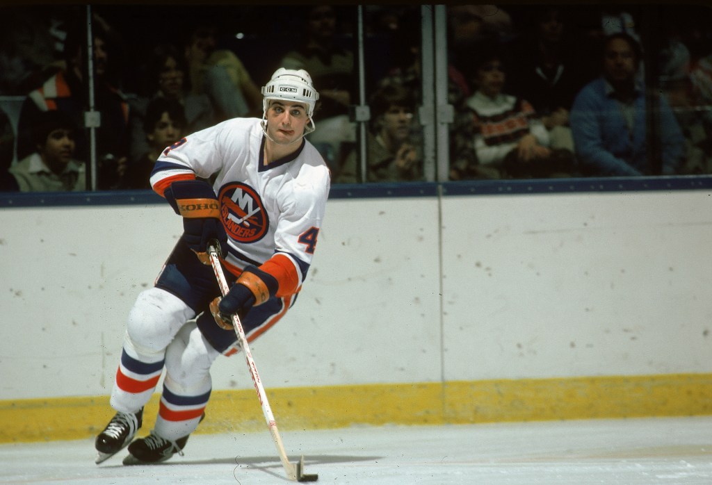 Paul Boutilier of the New York Islanders skates with the puck, March 1984
