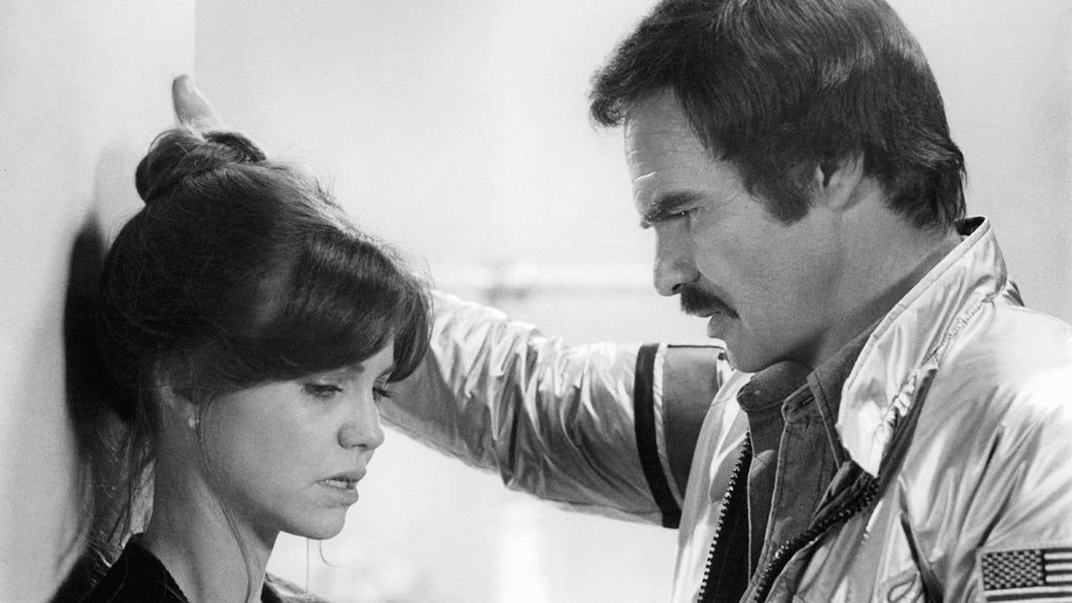 Sally Field talking while Burt Reynolds listens in a film scene