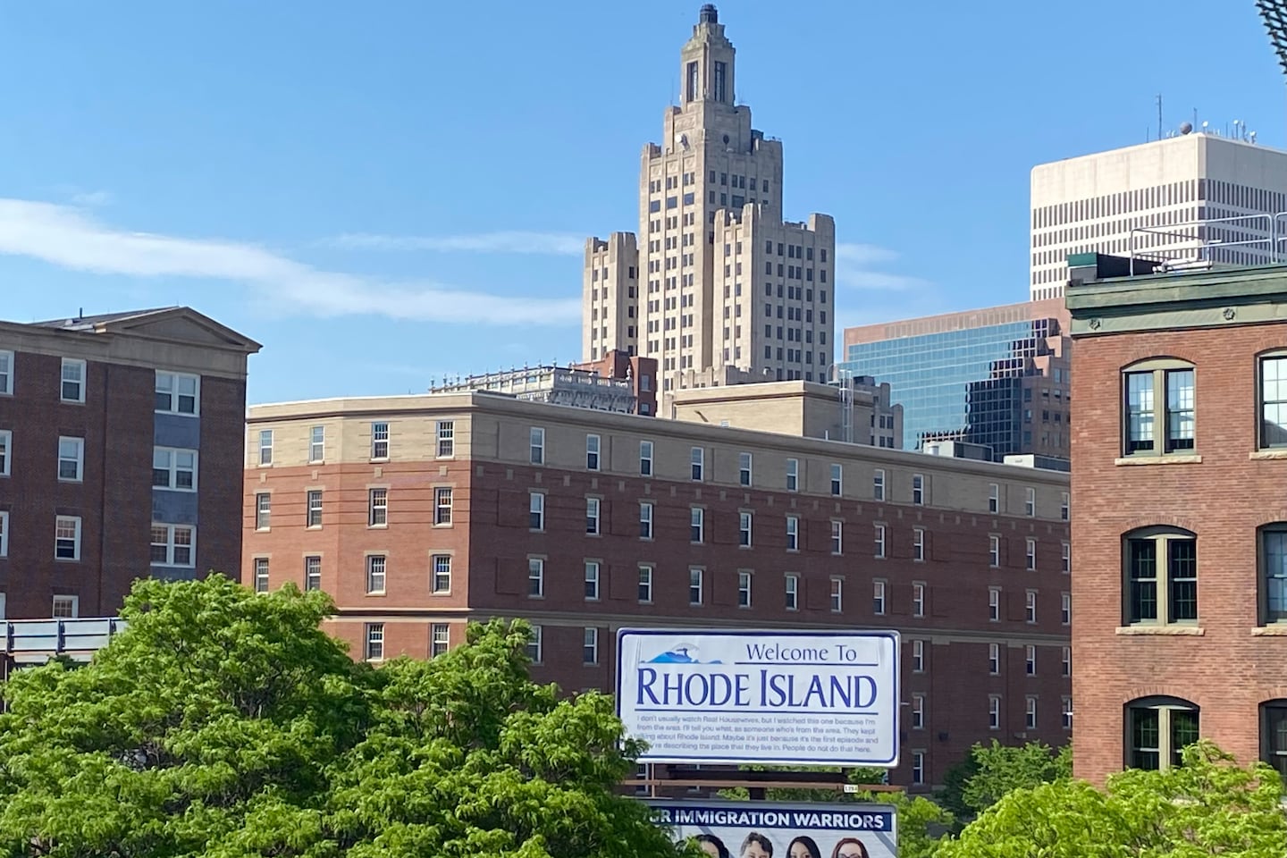 A "Welcome to Rhode Island" billboard featuring a Reddit comment about "The Real Housewives of Rhode Island" in downtown Providence is the work of Darian Newman, a graduate student at the Rhode Island School of Design.